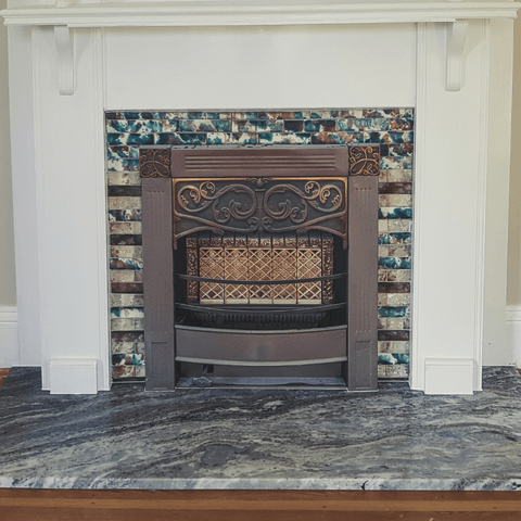 Brown Fantasy granite fireplace surround