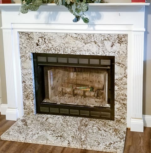 White Sands granite fireplace surround