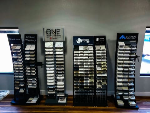 Slab and sample displays on the floor of the Set In Stone showroom in Valdosta
